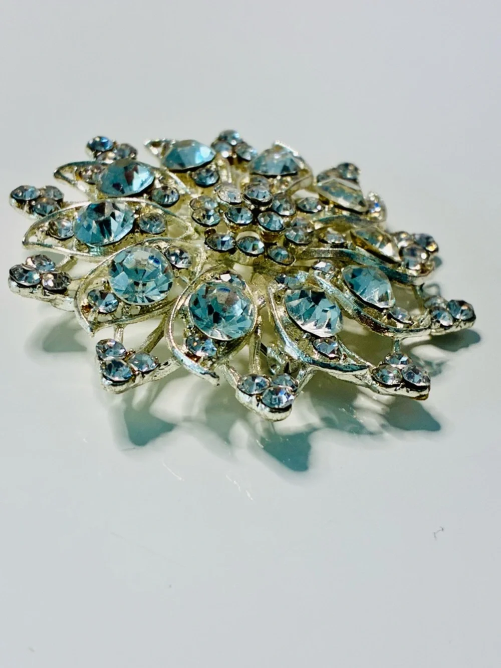 Crystal Floral Burst Brooch - Light Blue Rhinestone Accent